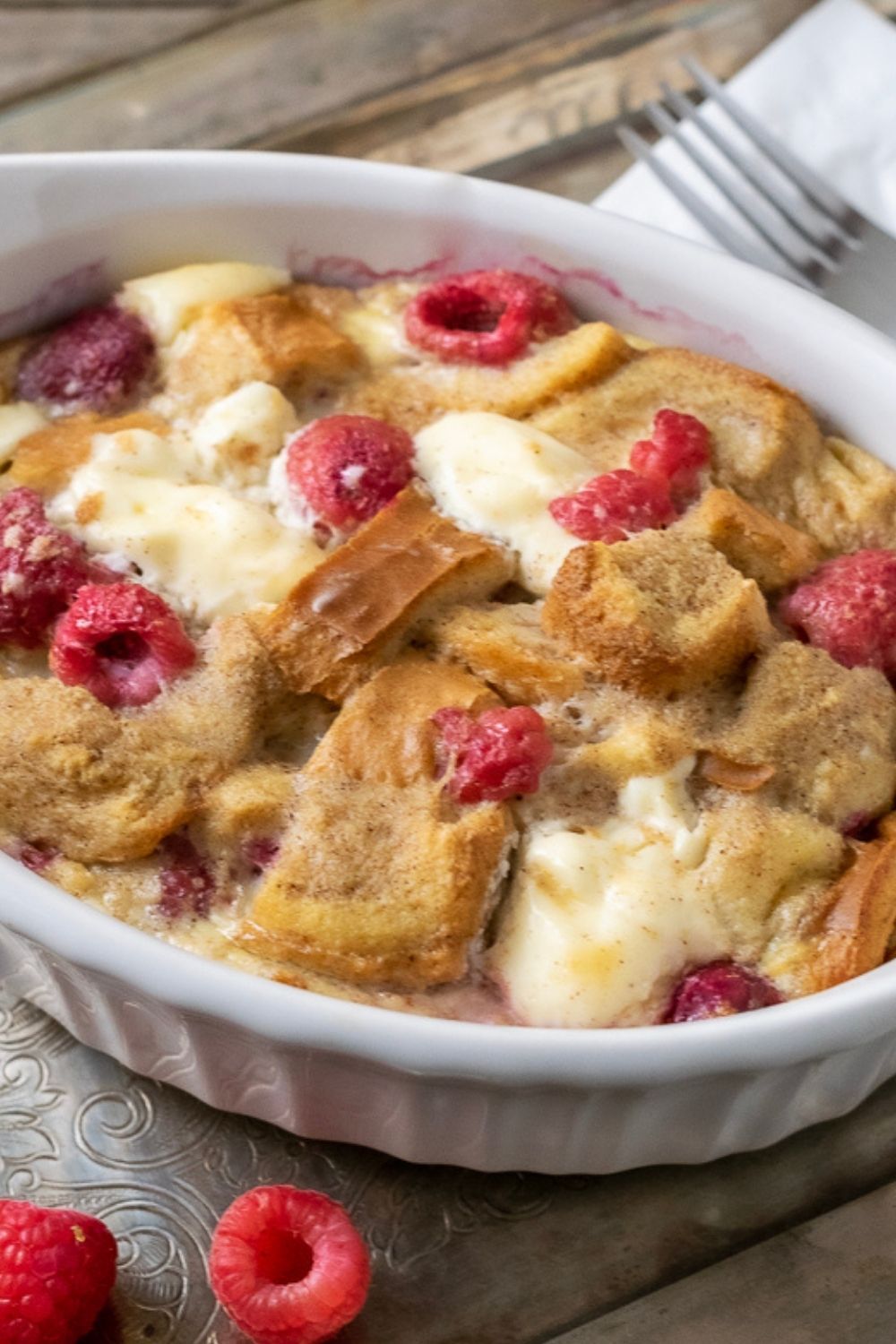Raspberry Cream Cheese French Toast Casserole in a baking dish.