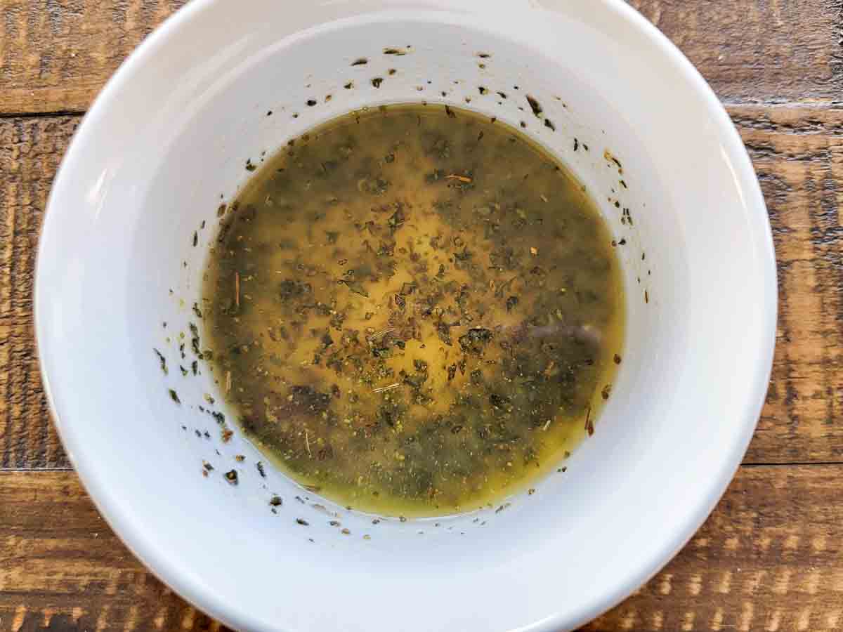 melted butter, garlic powder, coarse salt, and oregano in a small bowl.