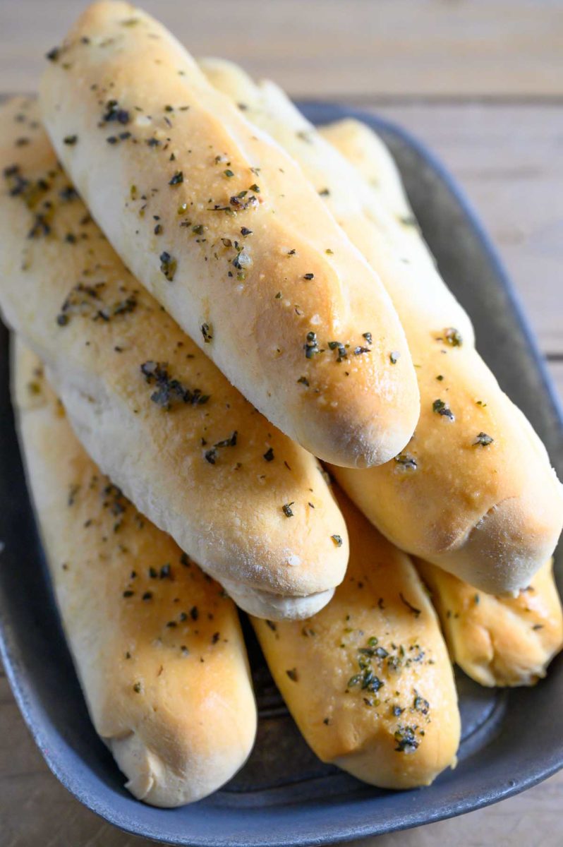 6 Ingredient Italian Breadsticks in a bread tray.