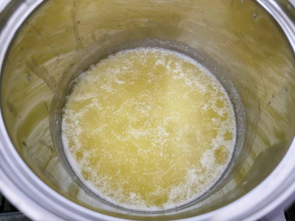 butter, honey, and garlic cooking in a pan.