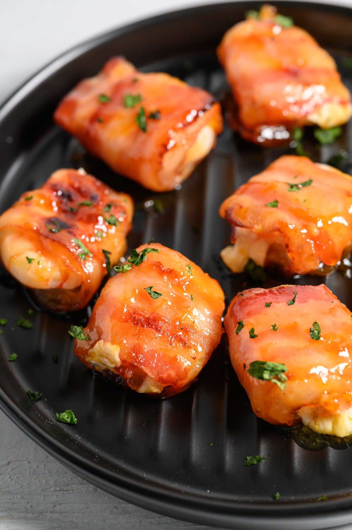 4 Ingredient Glazed Bacon Mozzarella Shrimp on a plate.