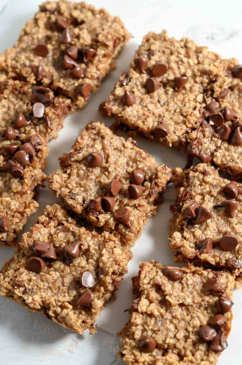 Banana Oat Bar squares on parchment paper.
