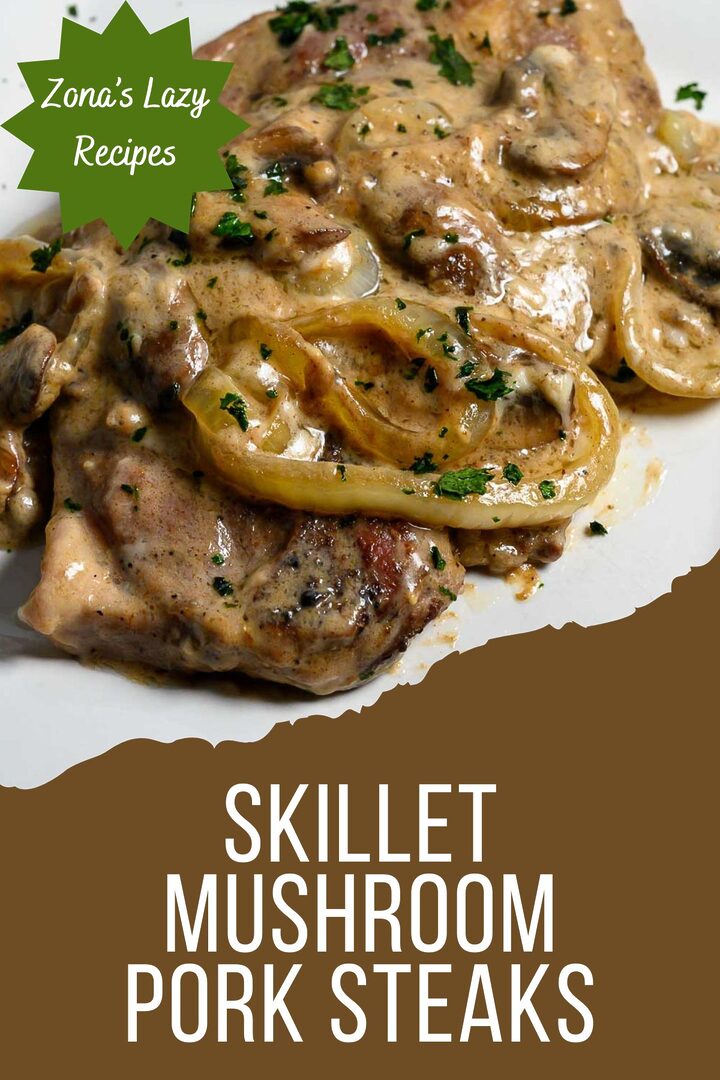 skillet mushroom pork steaks on a plate.