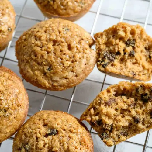 Oatmeal Raisin Muffins on a wire rack.