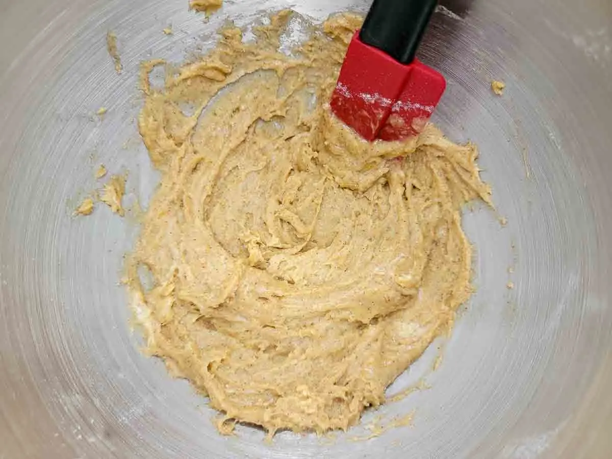 flour, baking soda, cinnamon, salt, egg, brown sugar, butter, and vanilla mixed in a bowl.