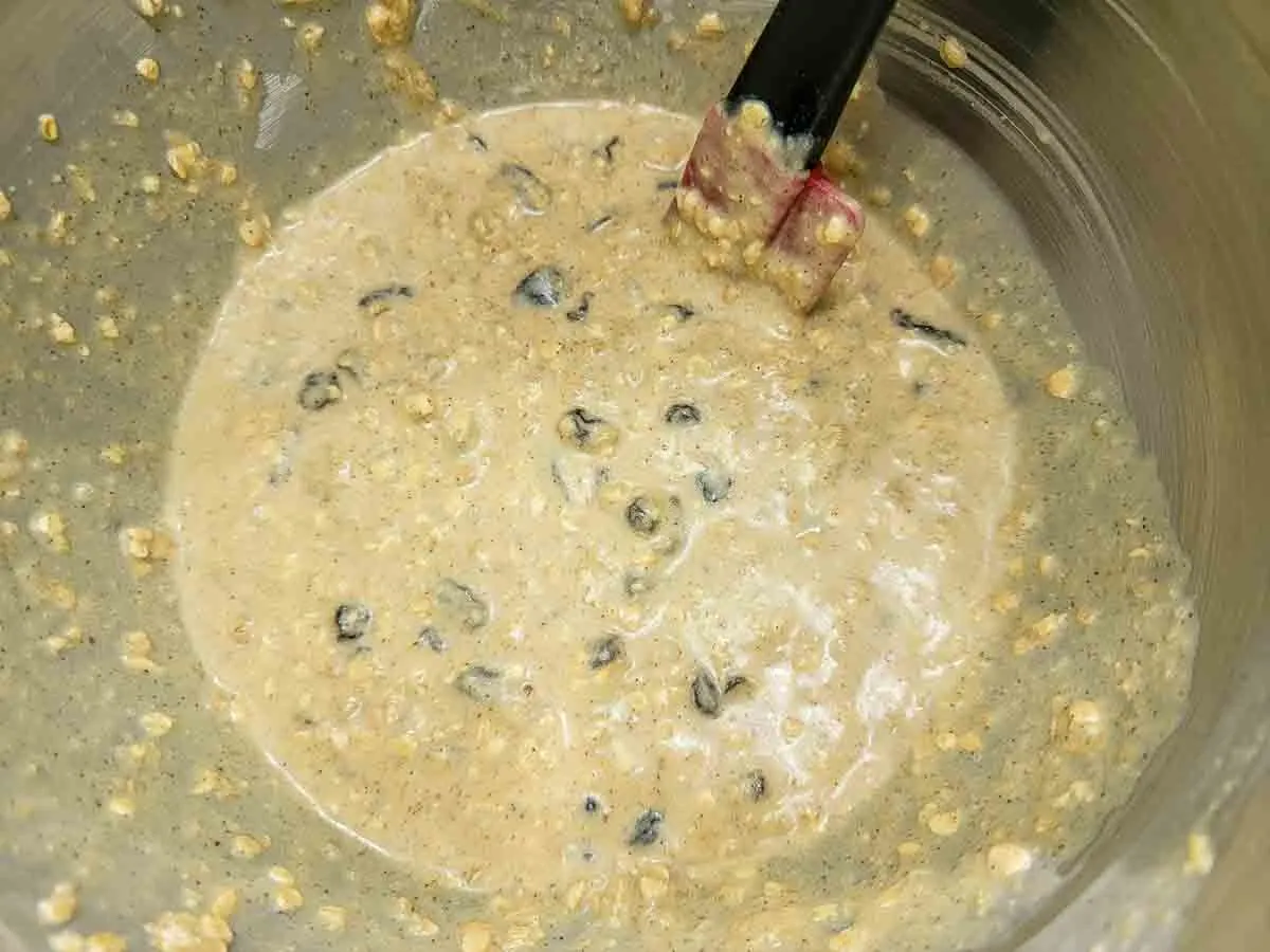 oatmeal raisin muffin batter mixed in a bowl.