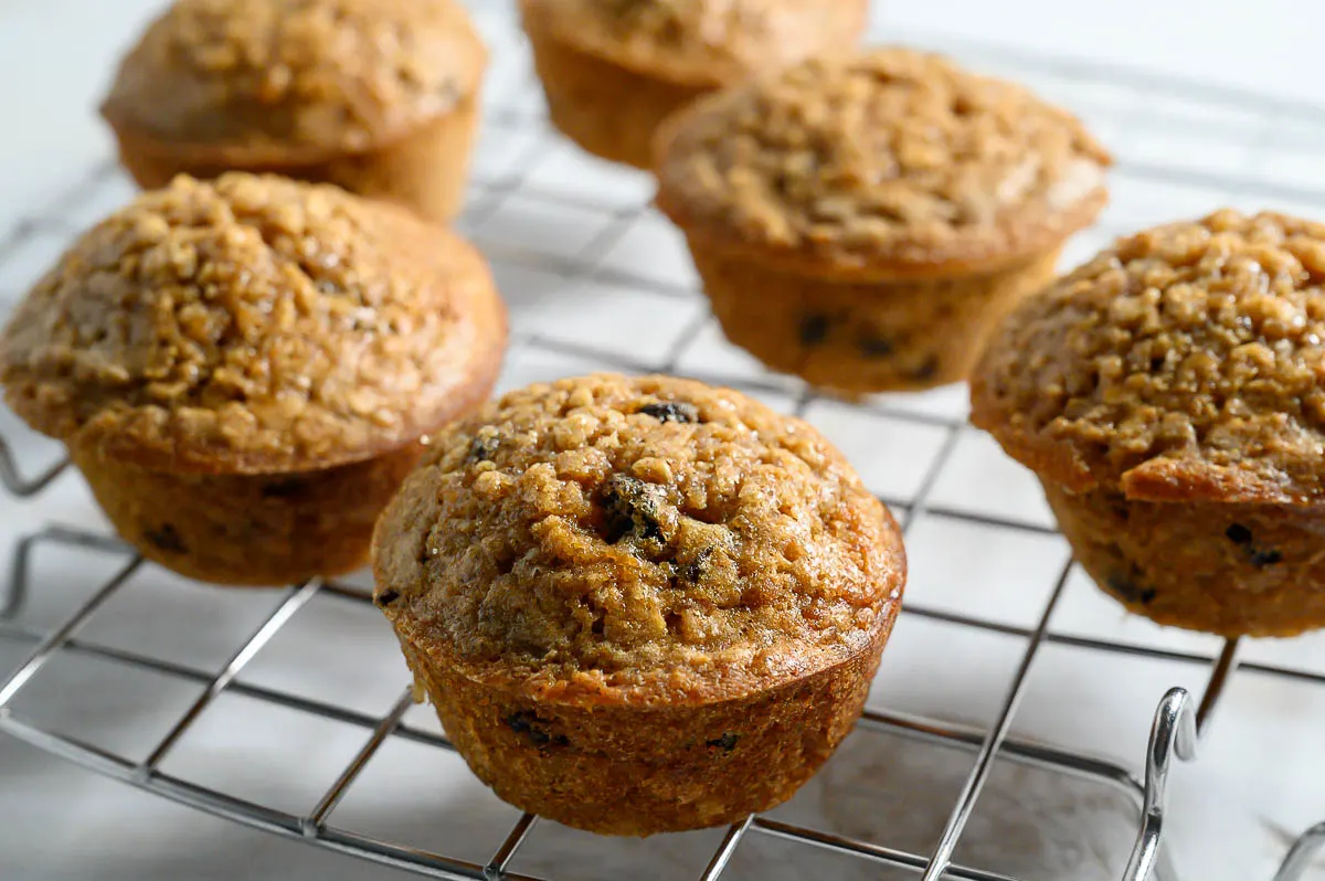 Oatmeal Raisin Muffins on a wire rack.