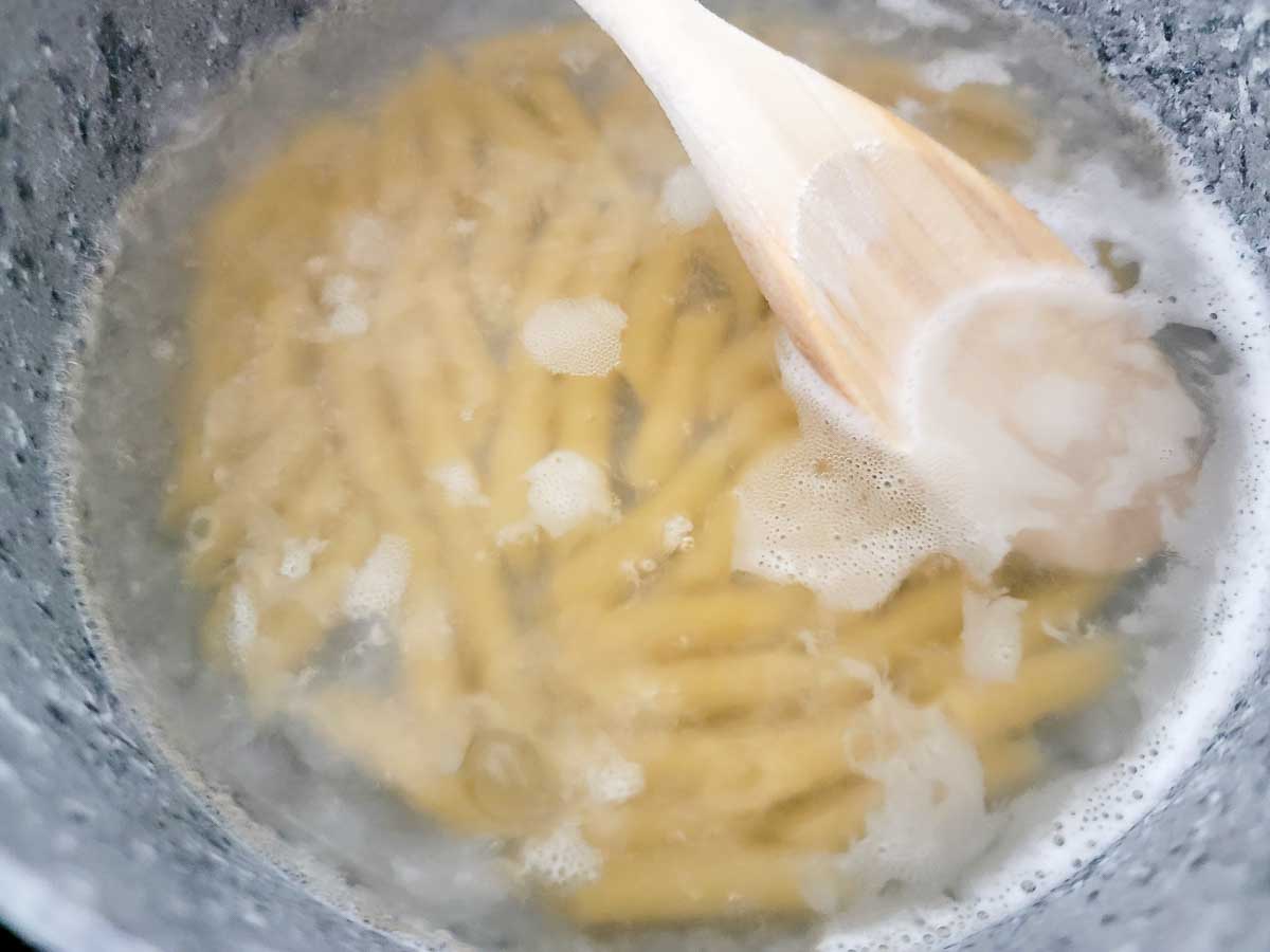 pasta cooking in a saucepan.