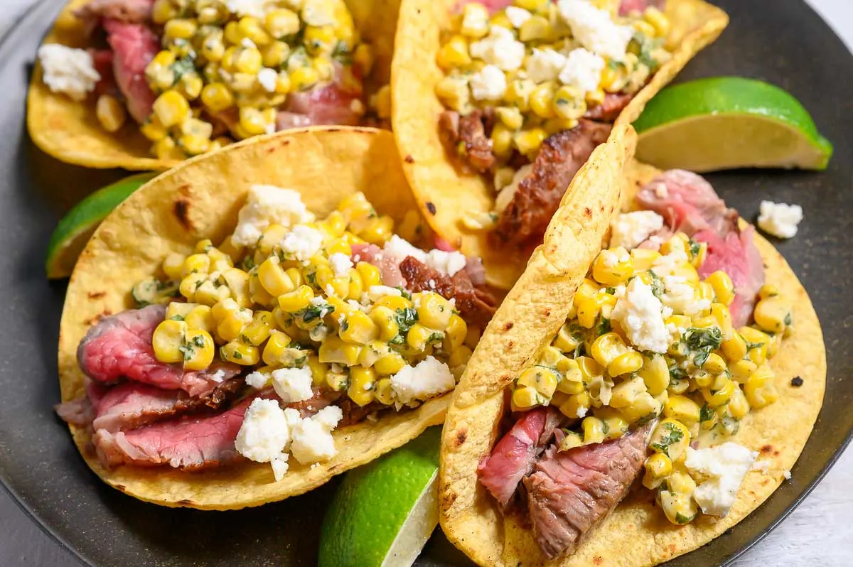 Beef Tenderloin and Elote Tacos on a plate.