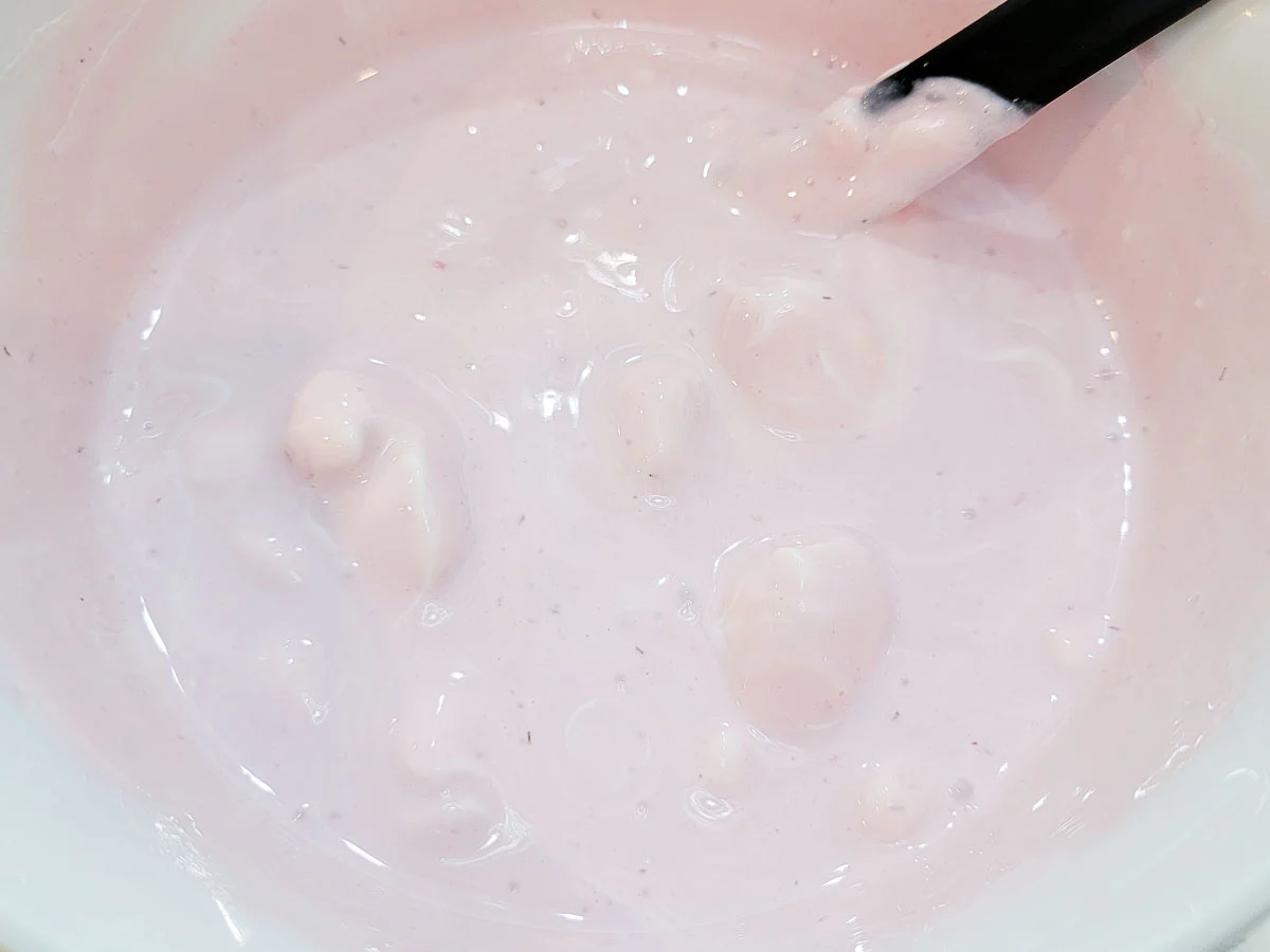 creamy strawberry mixture in a mixing bowl.