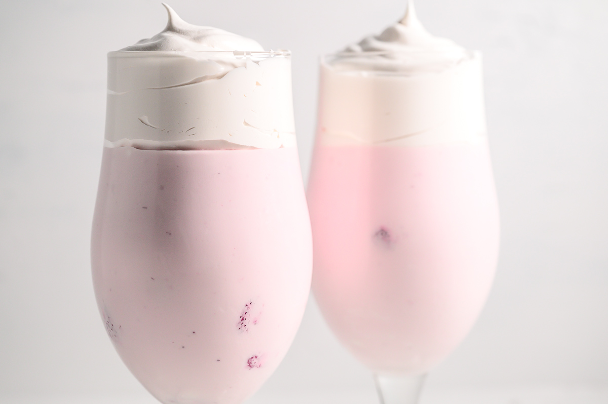 3 Ingredient Strawberry Fluff in 2 tall dessert glasses.