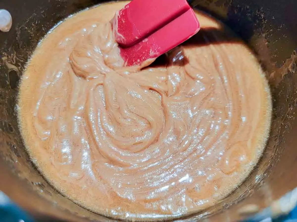 peanut butter and honey cooking in a pan.