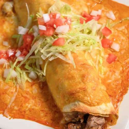 Ribeye Steak Wet Burrito on a plate.