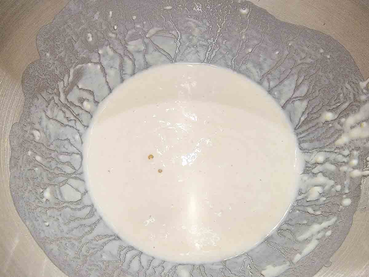 yeast, water, sugar, and flour in a large mixing bowl.