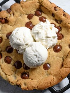 Mini Skillet Cookie topped with 3 scoops of vanilla ice cream.