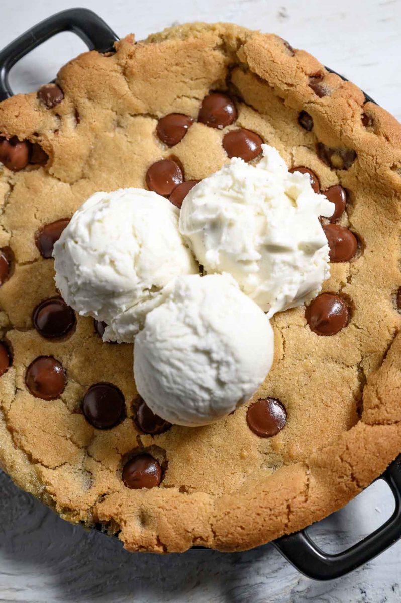 Mini Skillet Cookie topped with 3 scoops of vanilla ice cream.