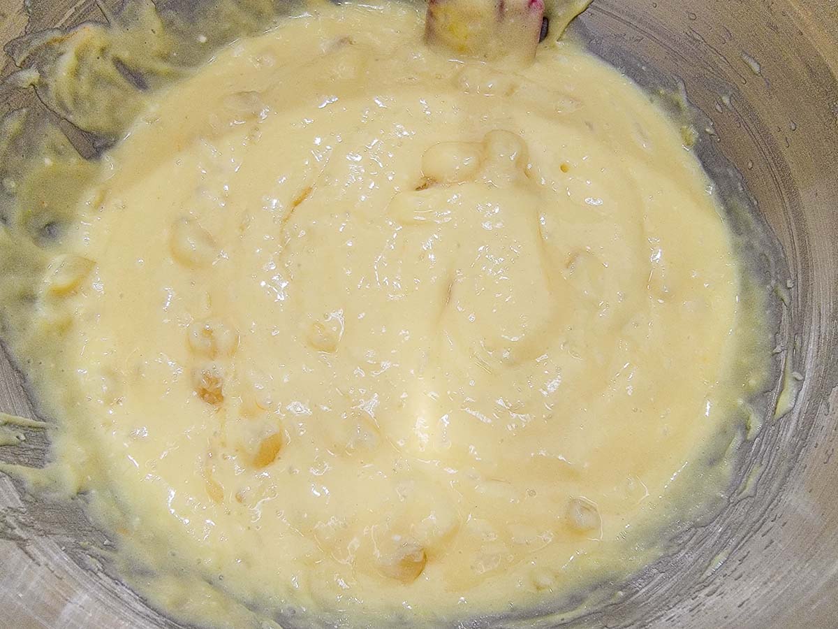 banana pudding and crushed pineapple cake batter mixed in a bowl.