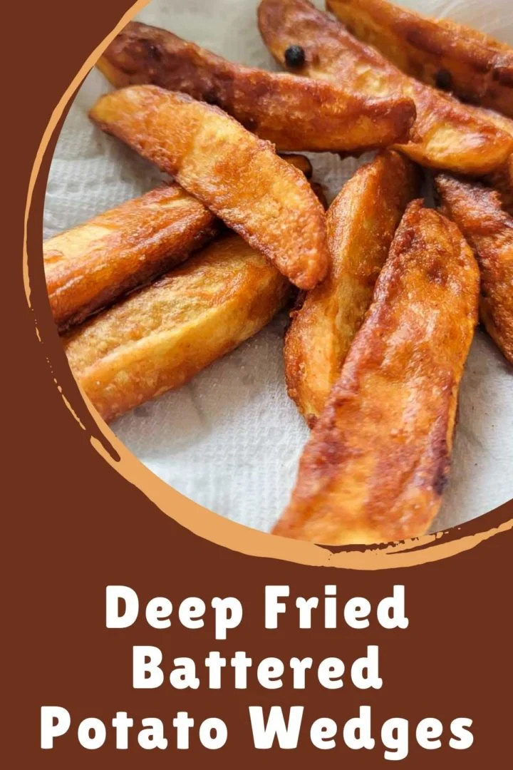Deep Fried Battered Potato Wedges on paper towel.