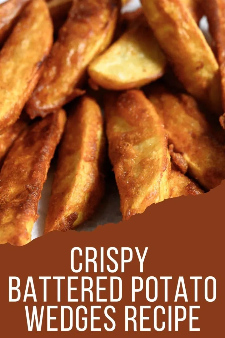 Battered Potato Wedges on paper towel.