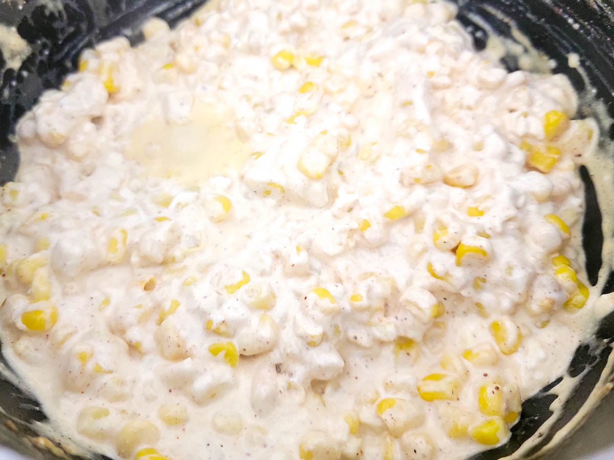 corn kernels, mayo, sour cream, chili powder, garlic powder, salt, and cayenne cooking in a large saucepan.