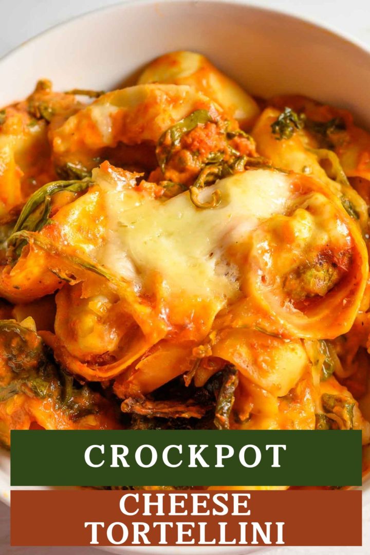 Crockpot Cheese Tortellini with spinach in a serving bowl.
