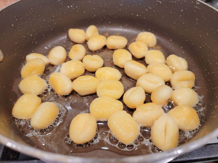 potato gnocchi frying in butter.