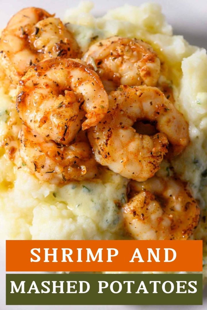 Shrimp and Mashed Potatoes with a thick, creamy basil and parmesan cheese sauce on a plate.