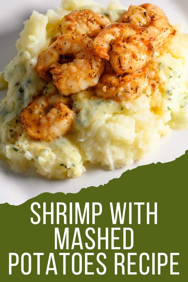 Shrimp and Mashed Potatoes with a thick, creamy basil and parmesan cheese sauce on a plate.