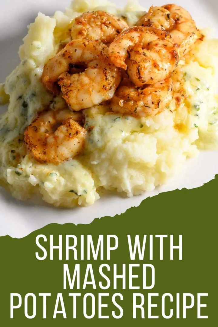 Shrimp and Mashed Potatoes with a thick, creamy basil and parmesan cheese sauce on a plate.