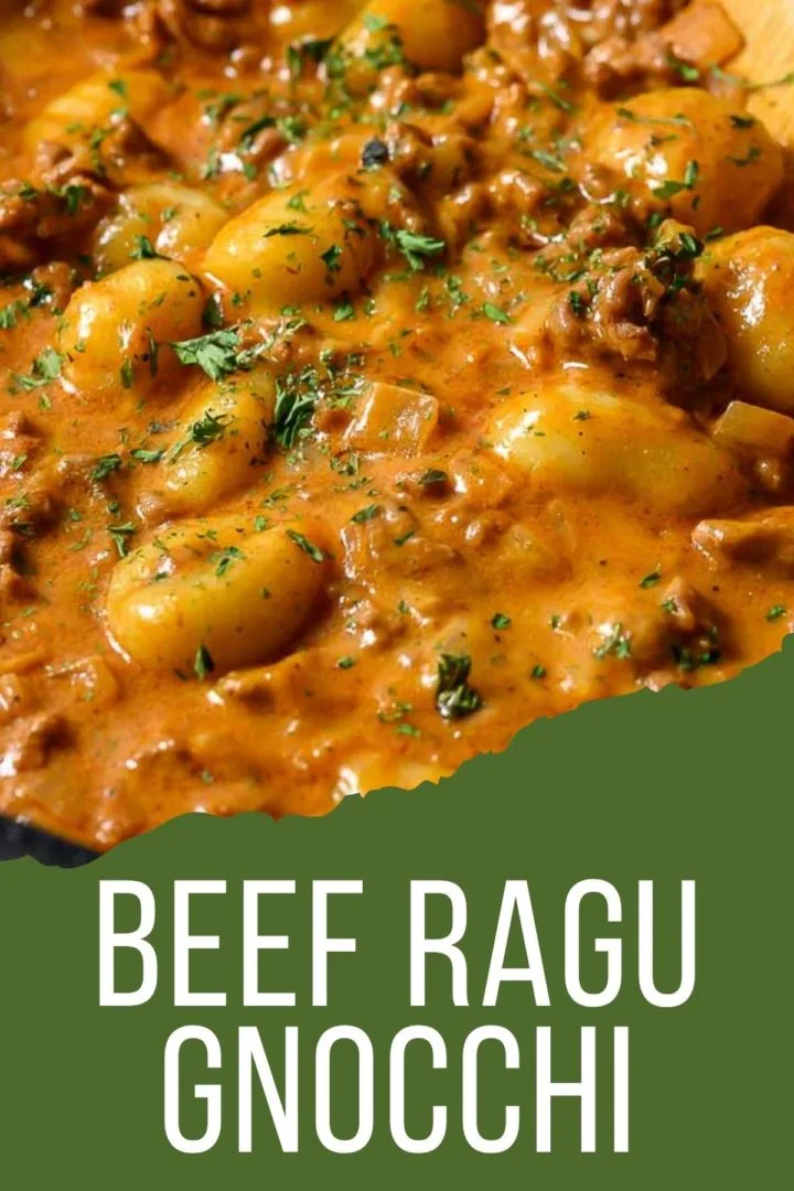 beef ragu gnocchi cooking in a pan.