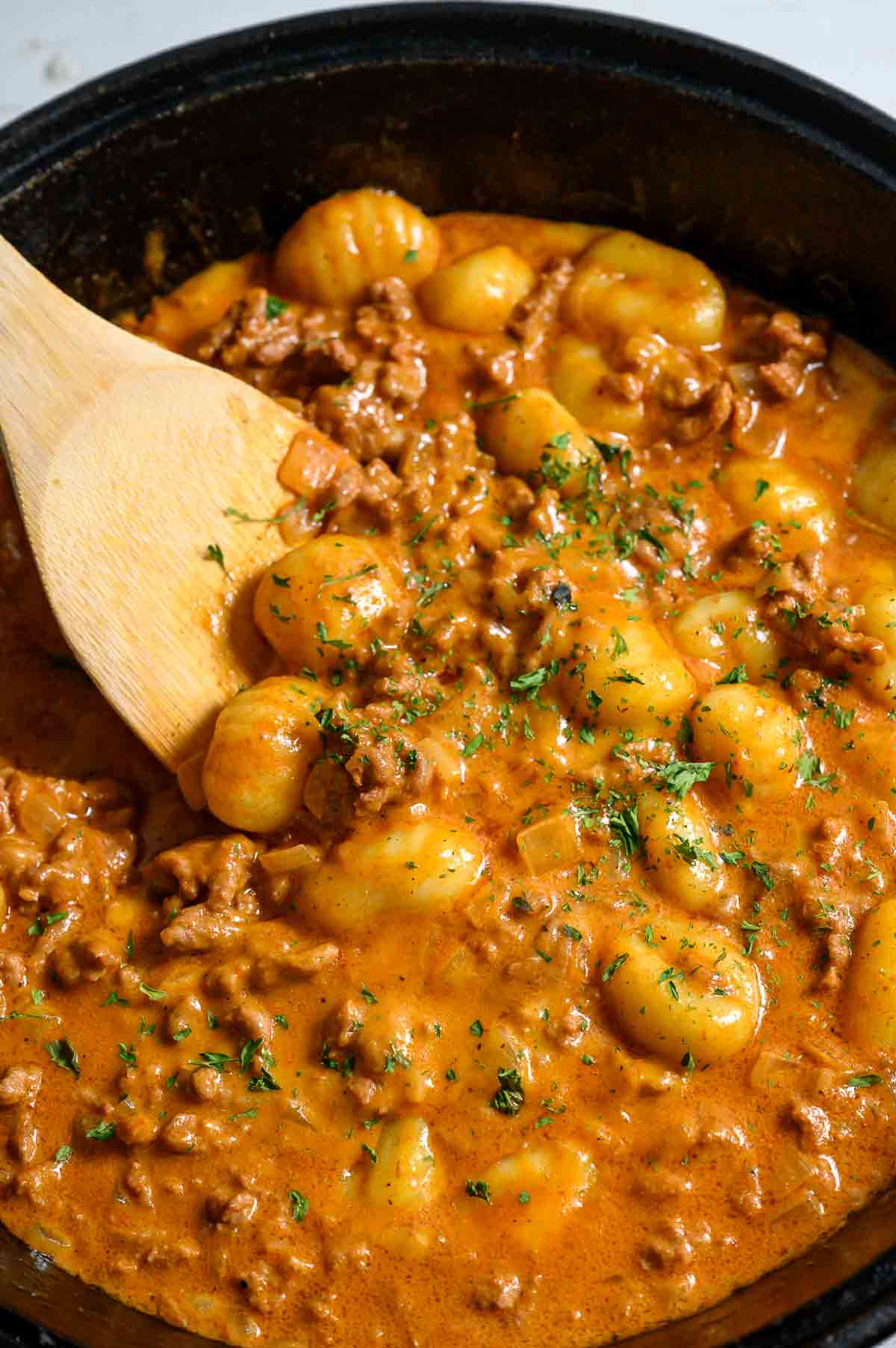 beef gnocchi cooking in a pan.
