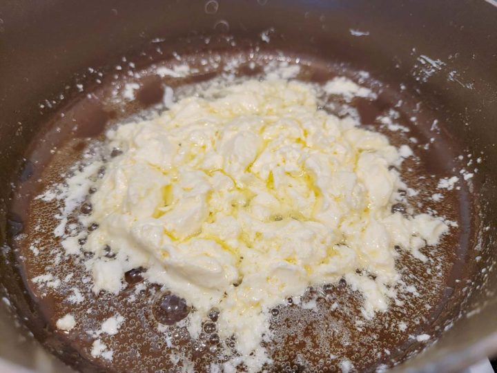 butter and cream cheese r cooking in a pan.