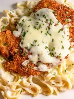 crispy panko fried chicken over pasta and topped with melted cheese.