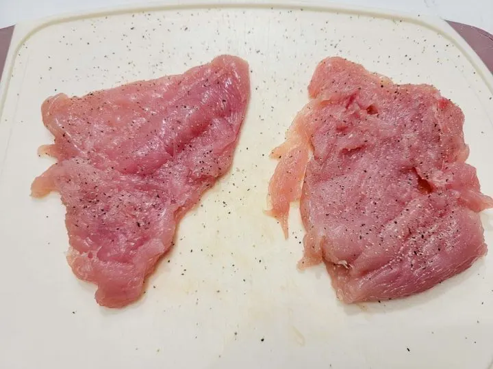 boneless chicken flattened and sprinkled with salt and pepper.