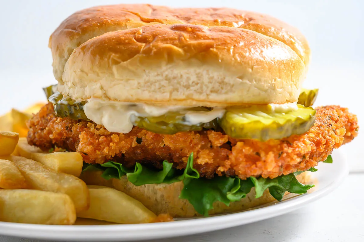 Crispy Chicken Sandwich and French fries on a plate.