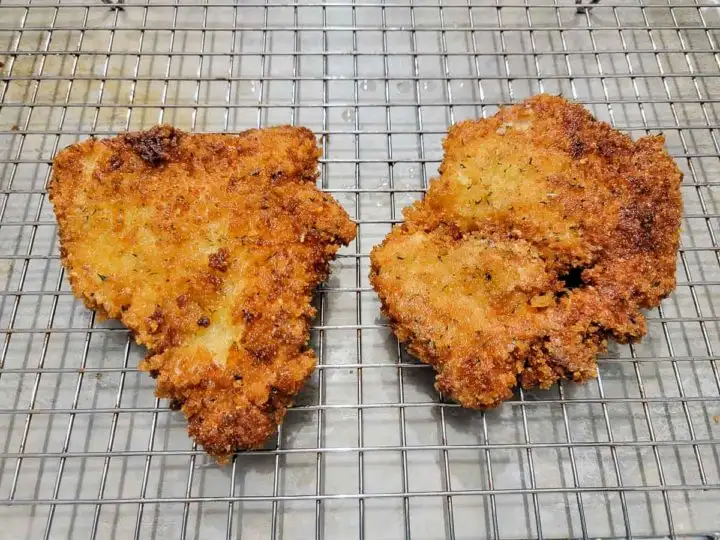 panko breaded chicken cooling on a wire rack.