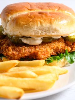 Crispy Chicken Sandwich and French fries on a plate.