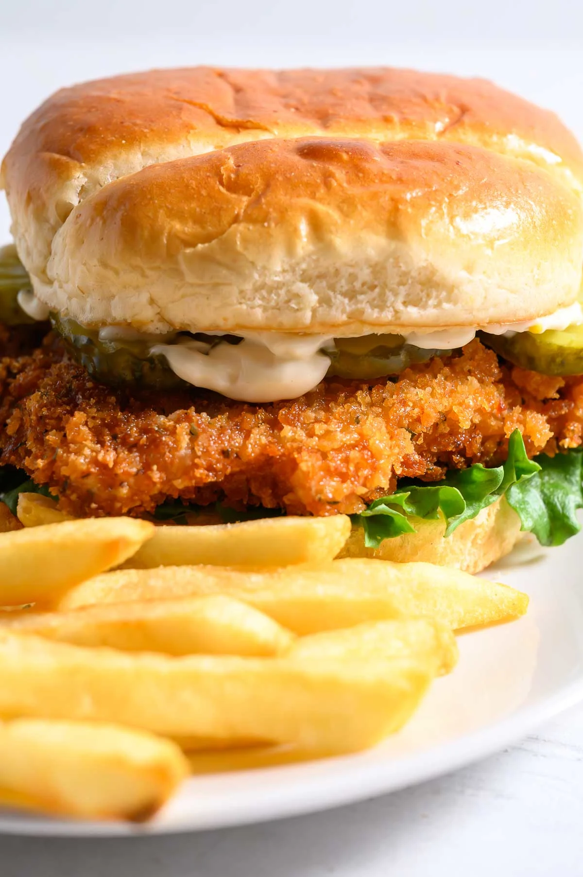 Crispy Chicken Sandwich and French fries on a plate.