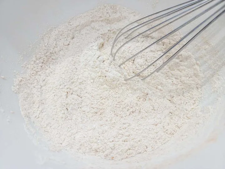 flour, salt, baking powder and cinnamon whisked in a bowl.