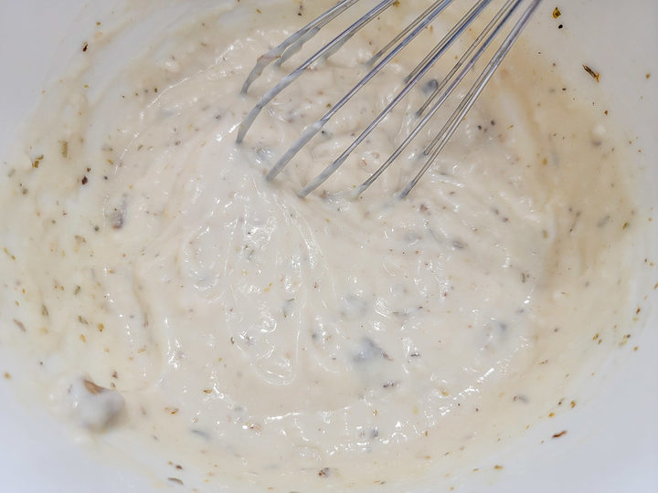 chicken broth, cream of chicken soup, garlic powder, onion powder, Italian seasoning, and black pepper whisked in a bowl.