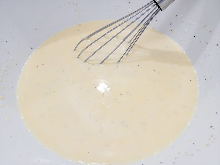 condensed soup, chicken broth, salt, pepper, garlic powder, and onion powder whisked in a bowl.