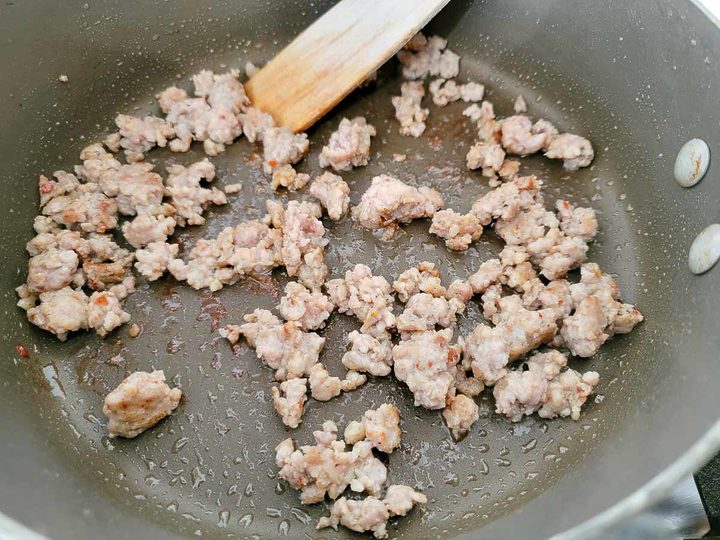 ground sausage cooking in a pan.