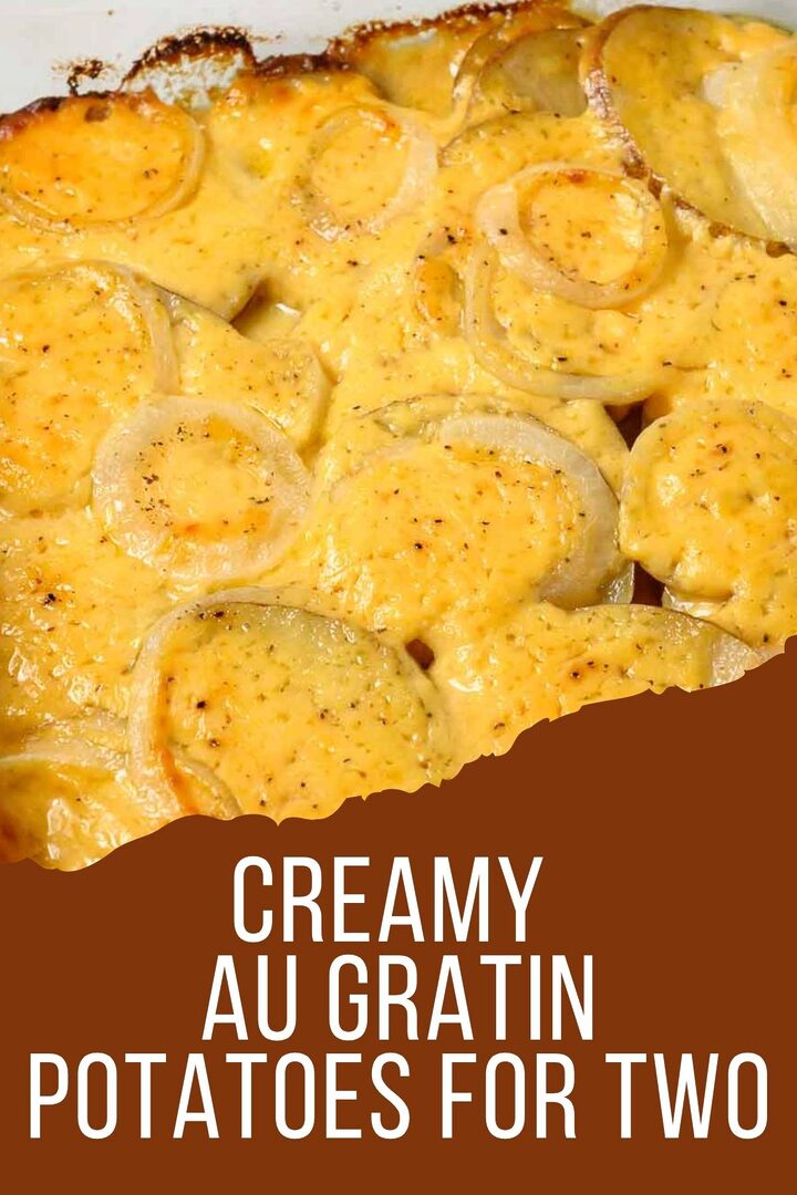 creamy au gratin potatoes for two in a baking dish.