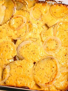 au gratin potatoes and onions in a baking dish.