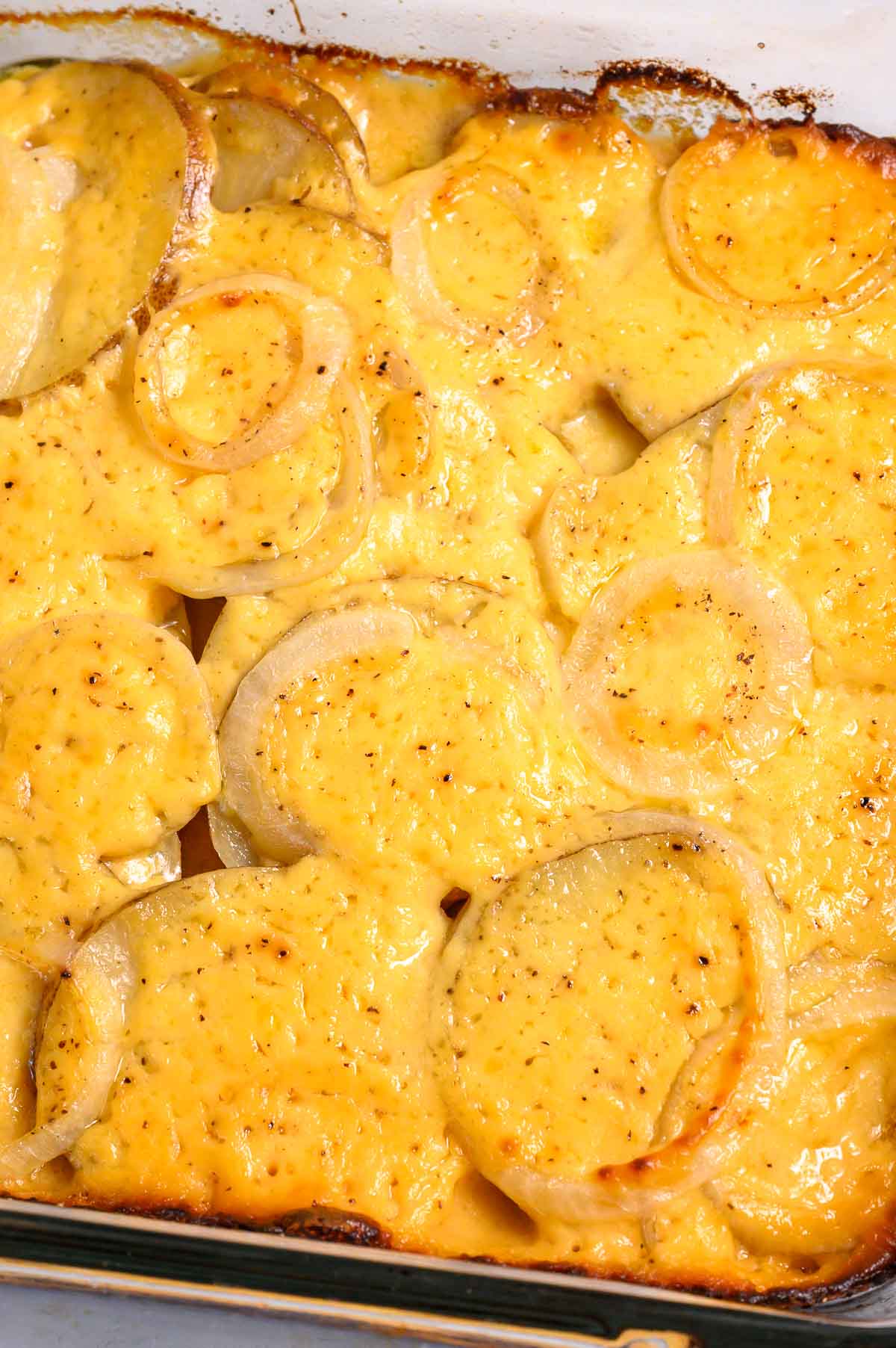 au gratin potatoes and onions in a baking dish.