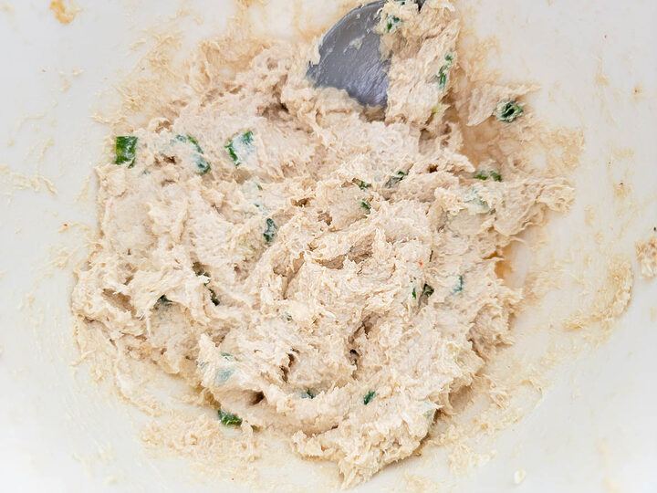crab meat, cream cheese, green onion, Worcestershire sauce, soy sauce, and garlic powder mixed in a bowl.