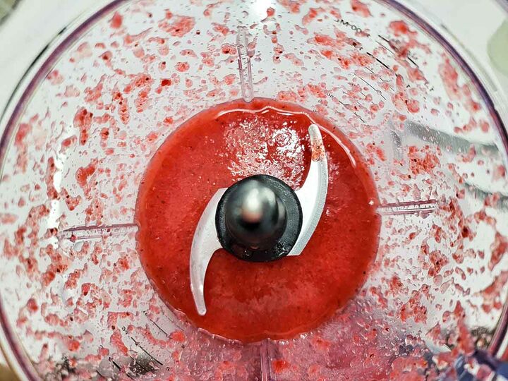 coconut rum, strawberries, and sugar mixed in a blender.