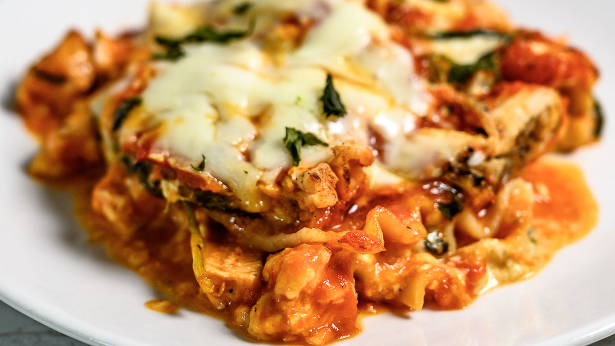 chicken and spinach lasagna on a plate.