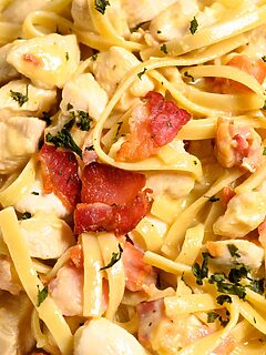 Bacon and chicken carbonara in a bowl.