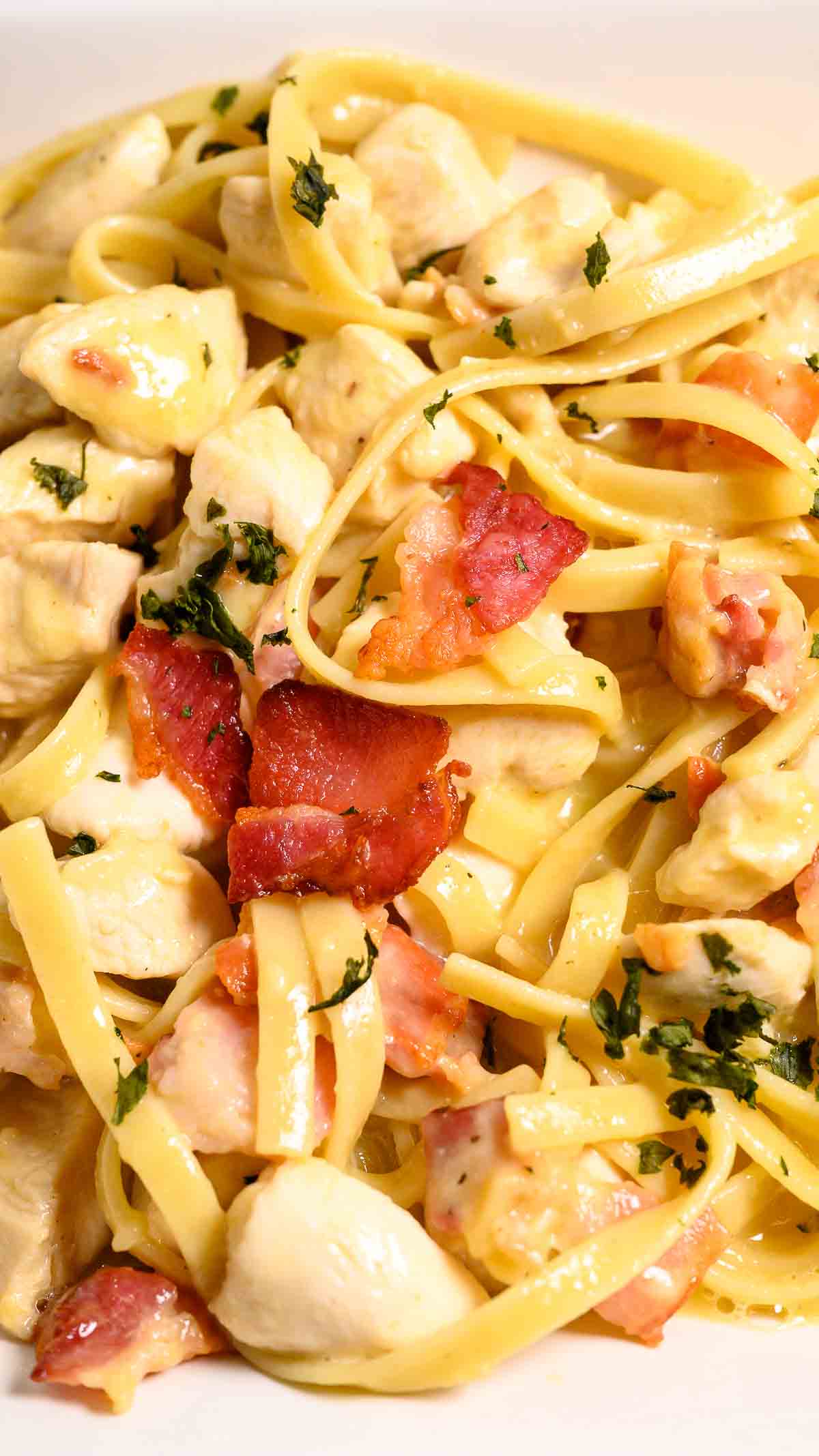 Bacon and chicken carbonara in a bowl.